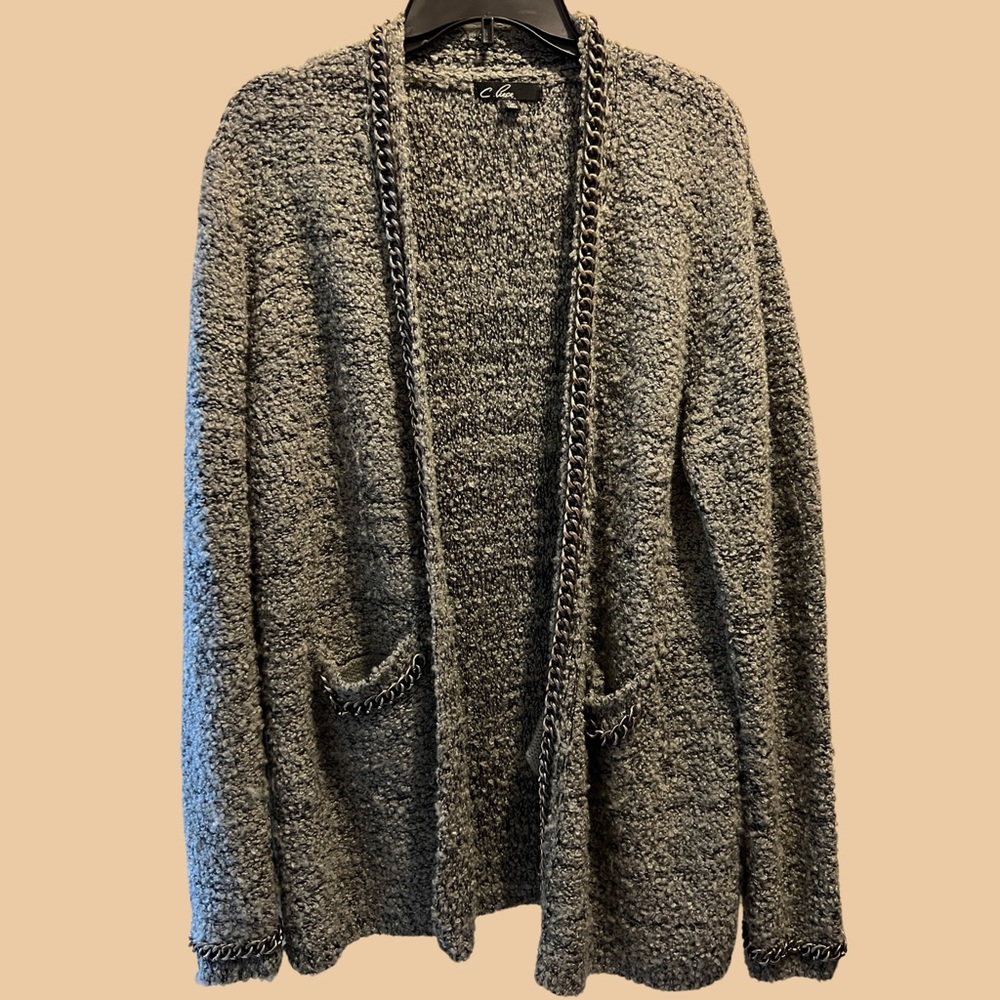 Gray cozy and warm sweater w/ silver chain detail on wrists, pocket and center.